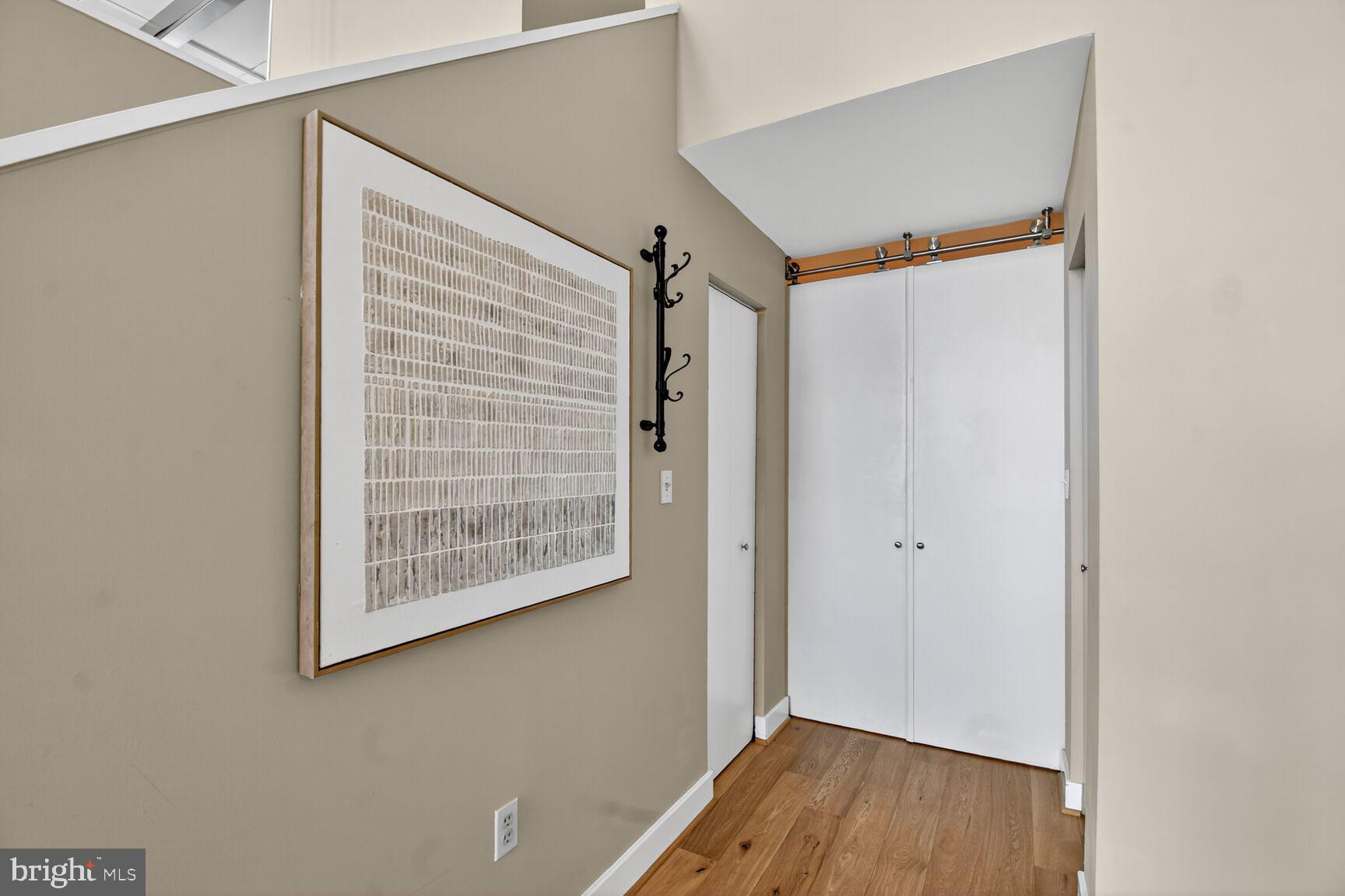 900 Bonifant Street, Unit D Silver Spring, MD 20910 - Photo 29 of 54 a view of an empty room with wooden floor and a window