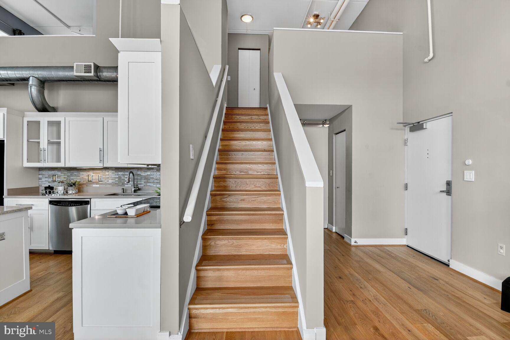 900 Bonifant Street, Unit D Silver Spring, MD 20910 - Photo 30 of 54 a view of a kitchen with wooden floor and electronic appliances