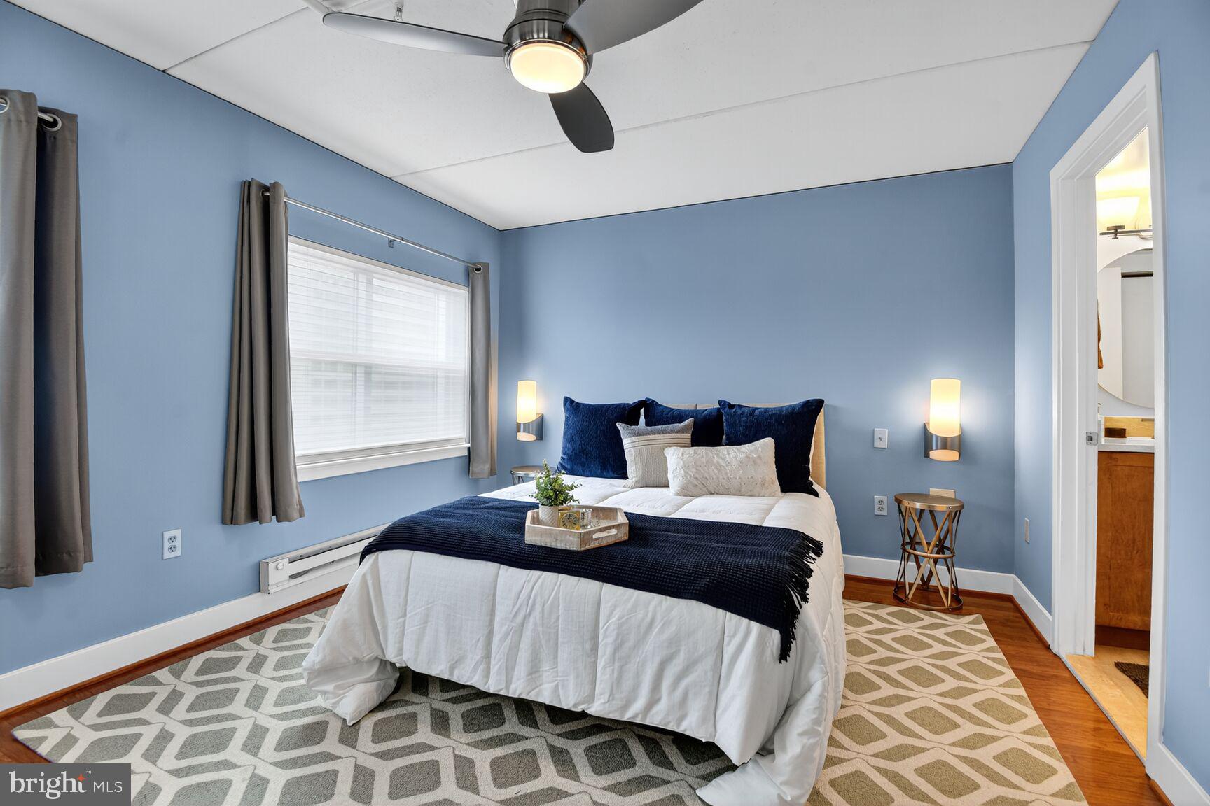 900 Bonifant Street, Unit D Silver Spring, MD 20910 - Photo 32 of 54 a bedroom with a bed and window