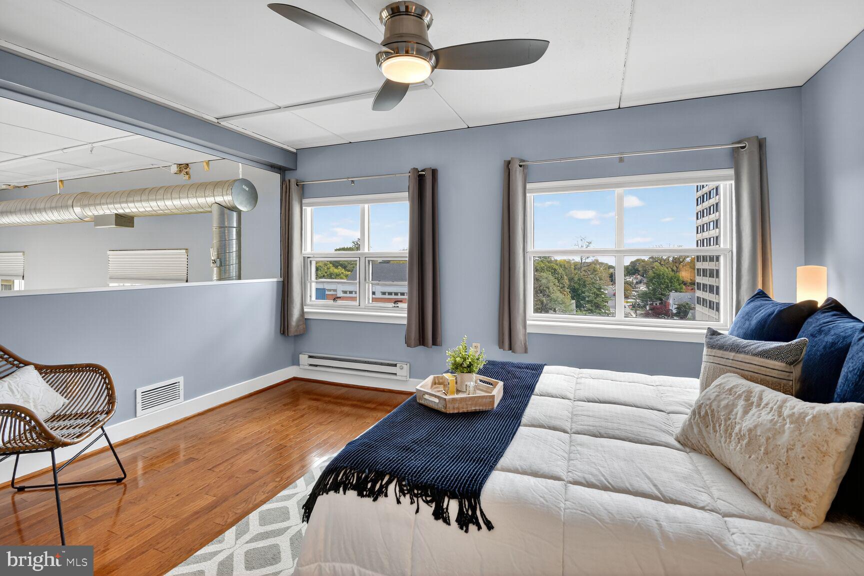 900 Bonifant Street, Unit D Silver Spring, MD 20910 - Photo 36 of 54 a living room with furniture and a large window