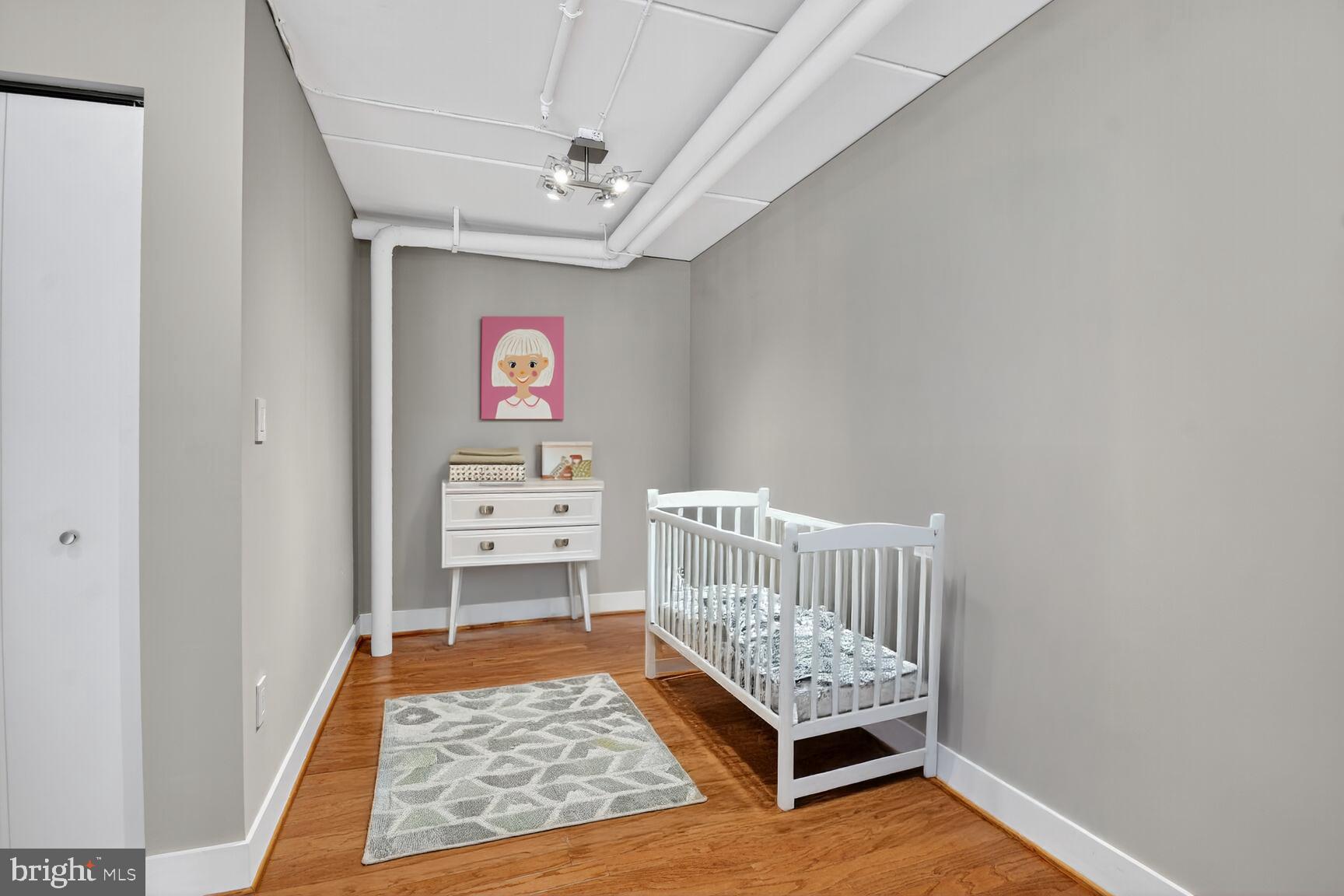 900 Bonifant Street, Unit D Silver Spring, MD 20910 - Photo 40 of 54 a room with toys and wooden floor
