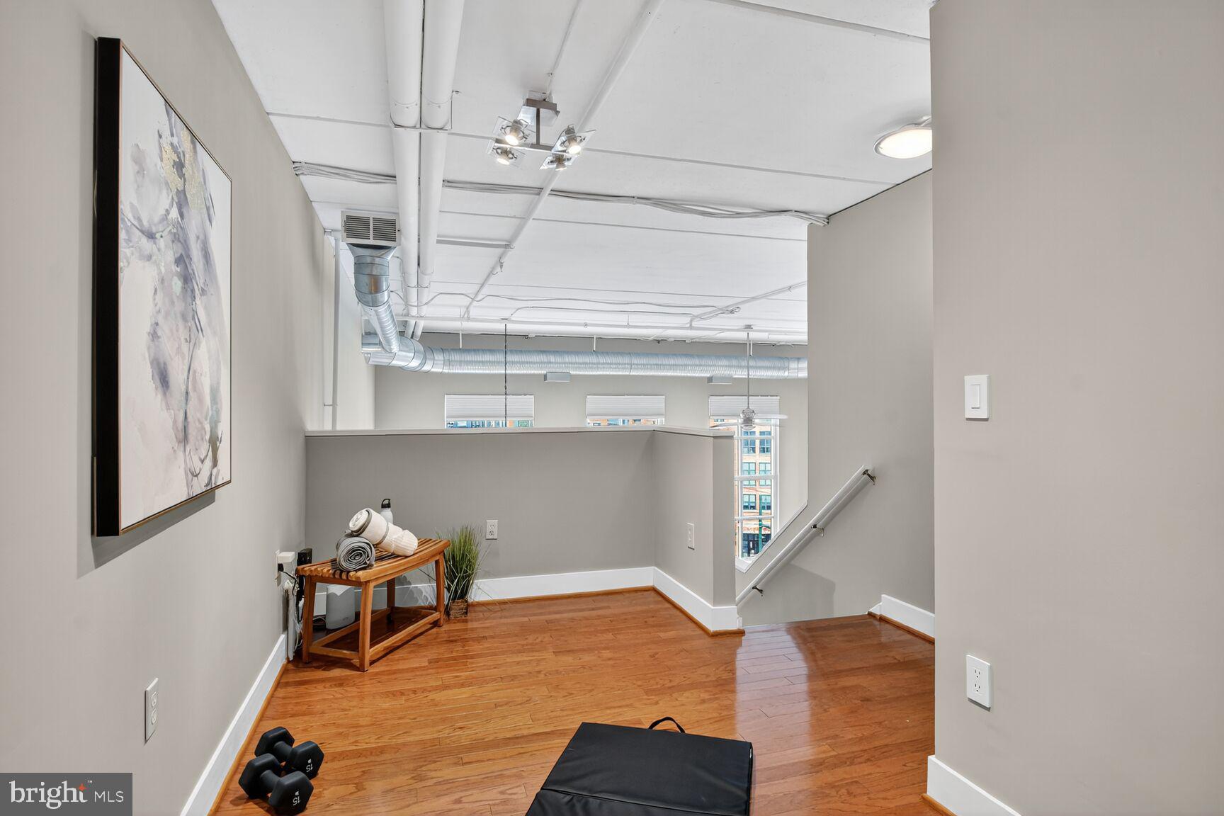 900 Bonifant Street, Unit D Silver Spring, MD 20910 - Photo 44 of 54 a view of hall way with furniture and staircase
