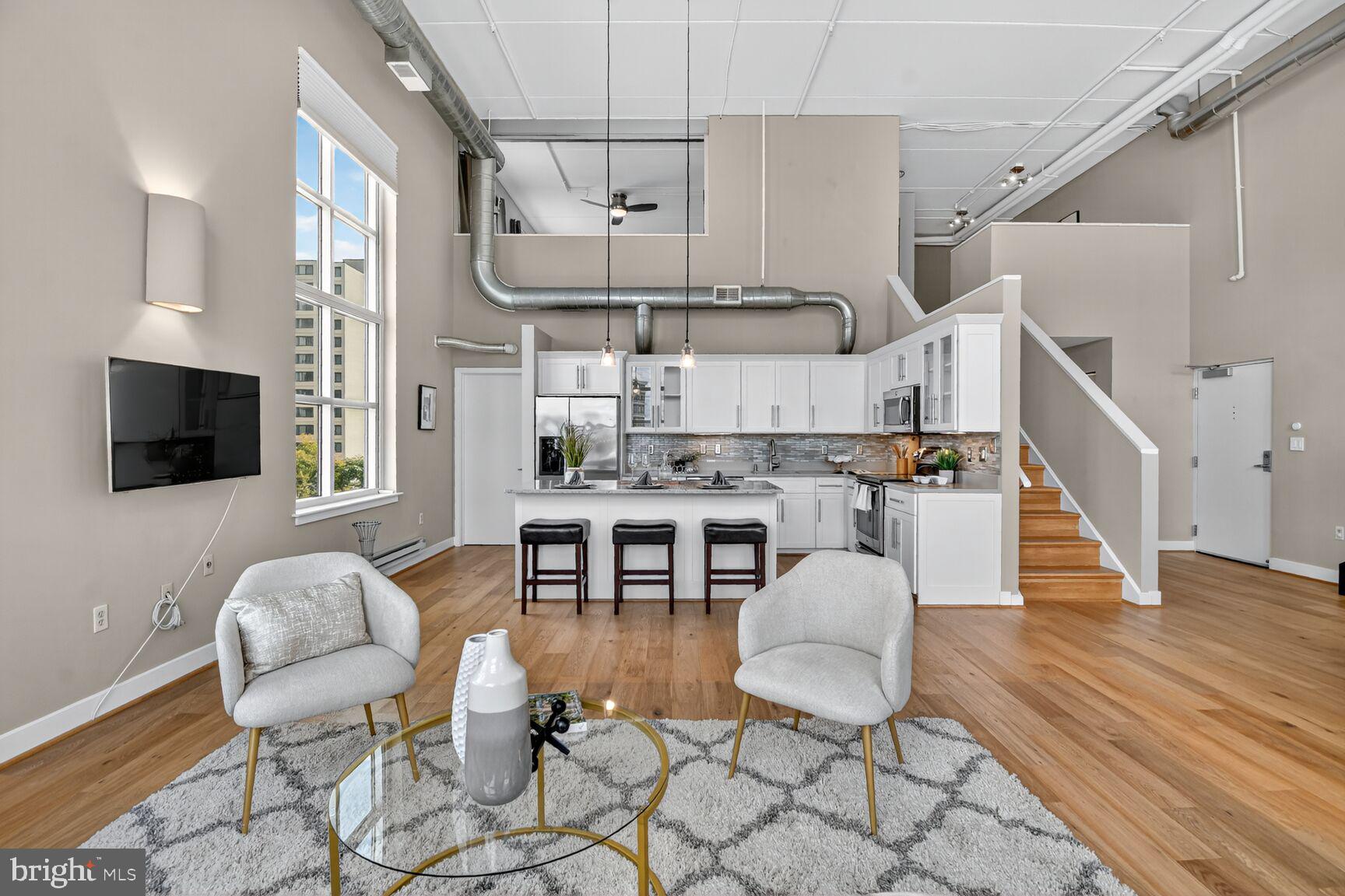 900 Bonifant Street, Unit D Silver Spring, MD 20910 - Photo 9 of 54 a living room with lots of furniture and kitchen view