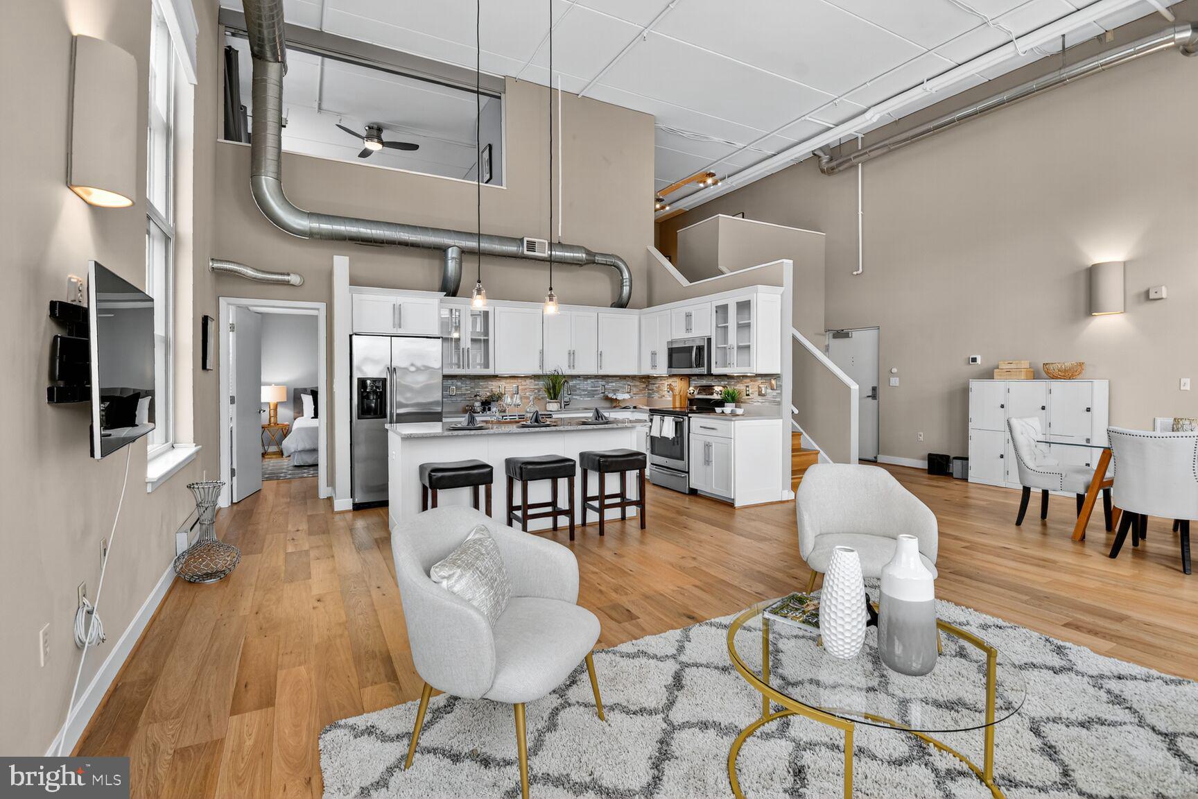 900 Bonifant Street, Unit D Silver Spring, MD 20910 - Photo 10 of 54 a living room with lots of furniture and kitchen view