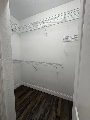 a view of a room with racks on the wall