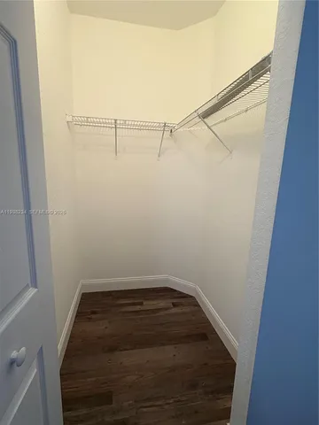 a view of a room with racks on the wall