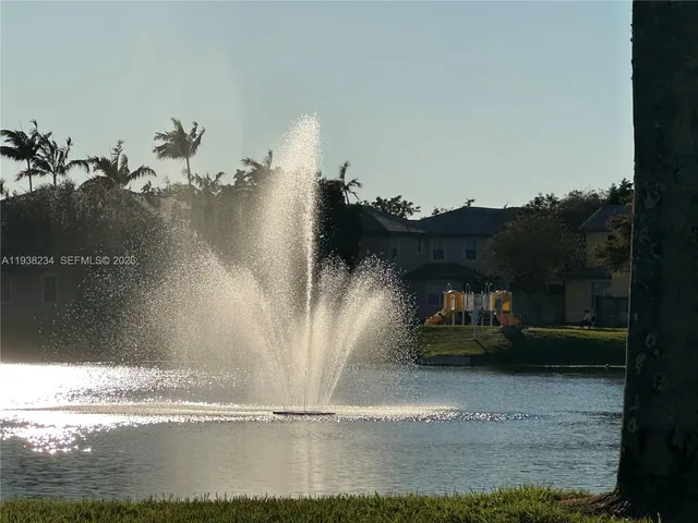 a view of wooden deck and a lake view