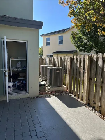 a view of front door and deck of the house