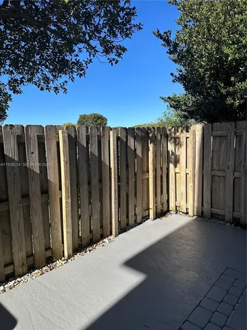a view of a backyard of the house