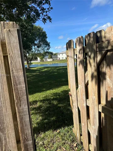 a view of a yard with swing chair