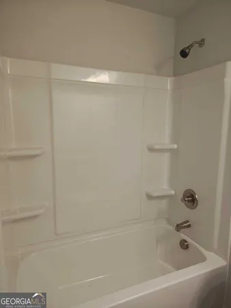a close up of a bathtub curtain