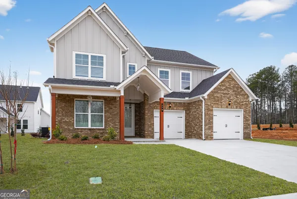 a front view of a house with a yard
