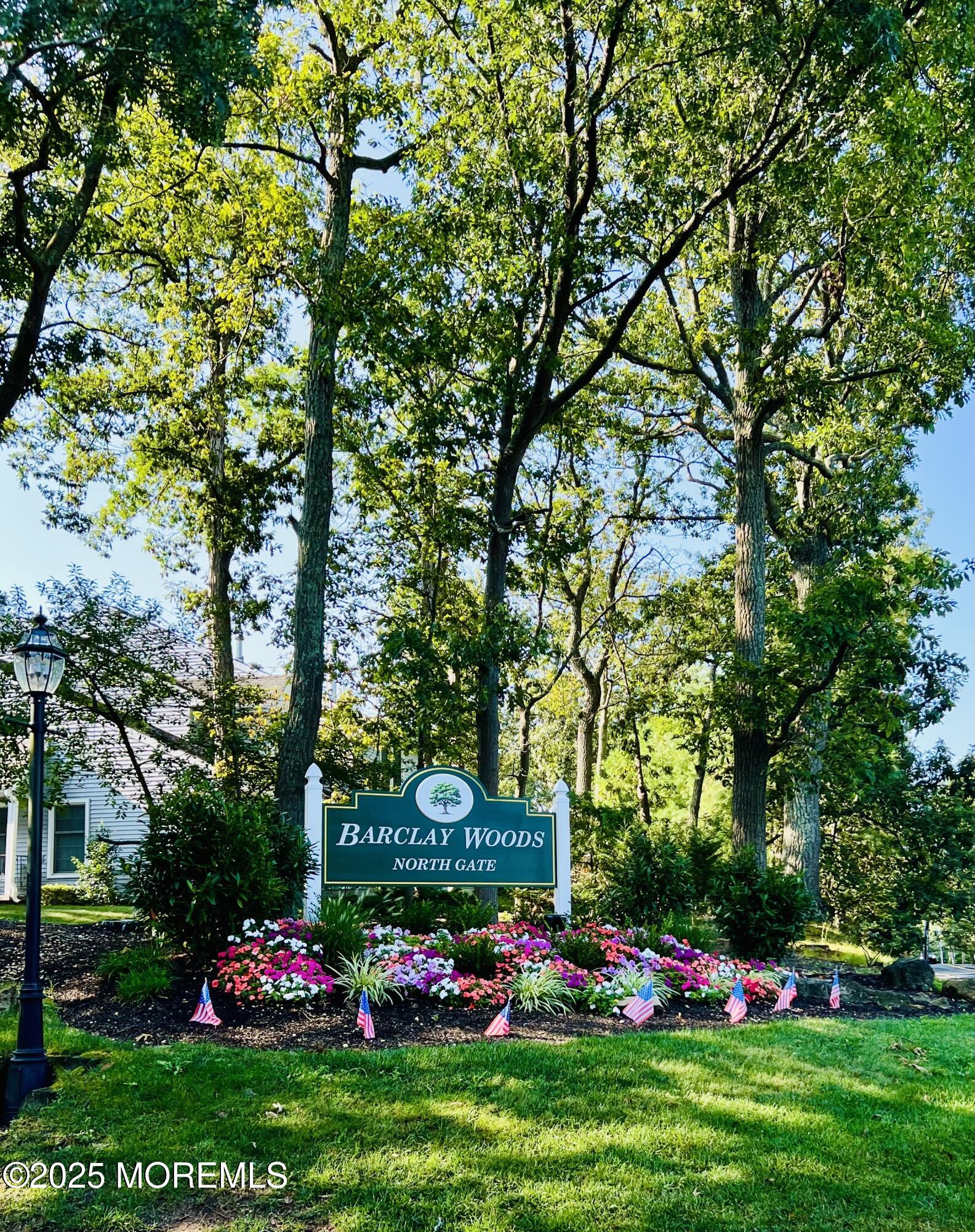 a front view of a multi story residential apartment building with trees