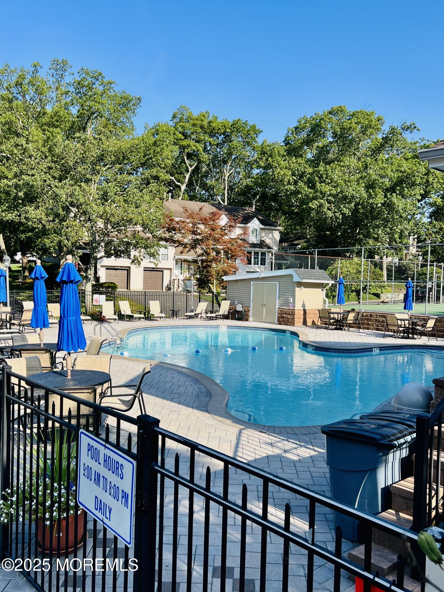 29 Mulberry Court, Unit D Brielle, NJ 08730 - Photo 20 of 22 a view of a chairs and table in the balcony
