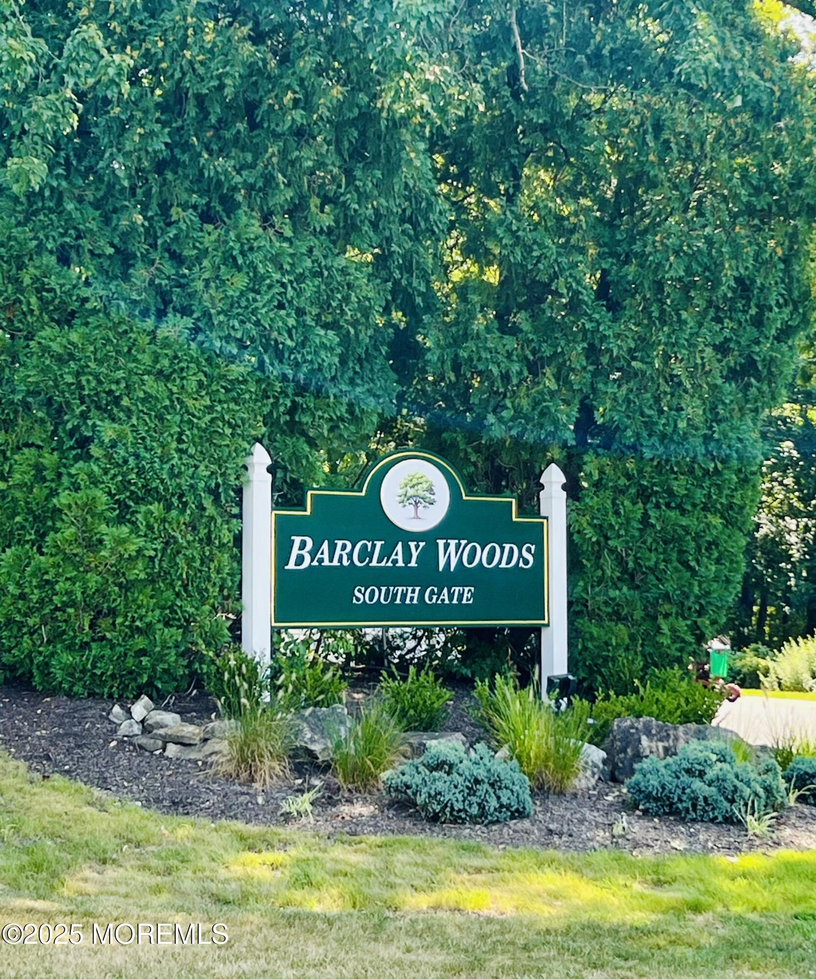 29 Mulberry Court, Unit D Brielle, NJ 08730 - Photo 2 of 22 a sign that is sitting on a pole