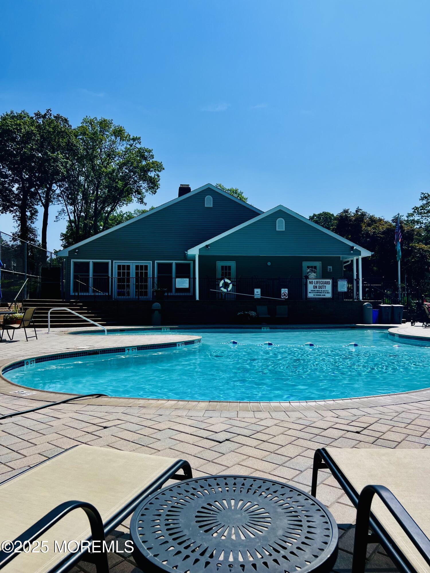29 Mulberry Court, Unit D Brielle, NJ 08730 - Photo 22 of 22 a front view of a house with a garden