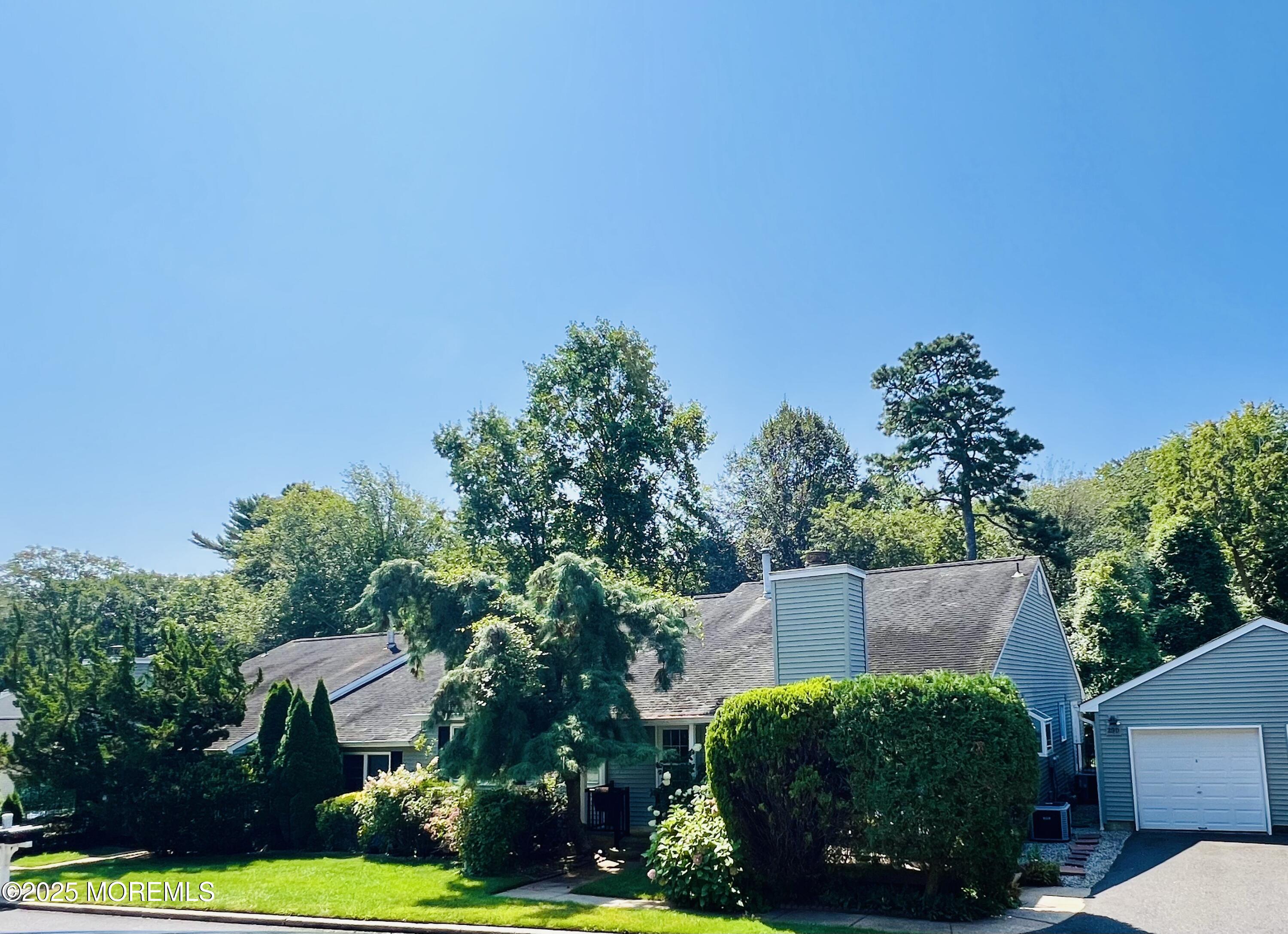 29 Mulberry Court, Unit D Brielle, NJ 08730 - Photo 3 of 22 front view of a house with a yard