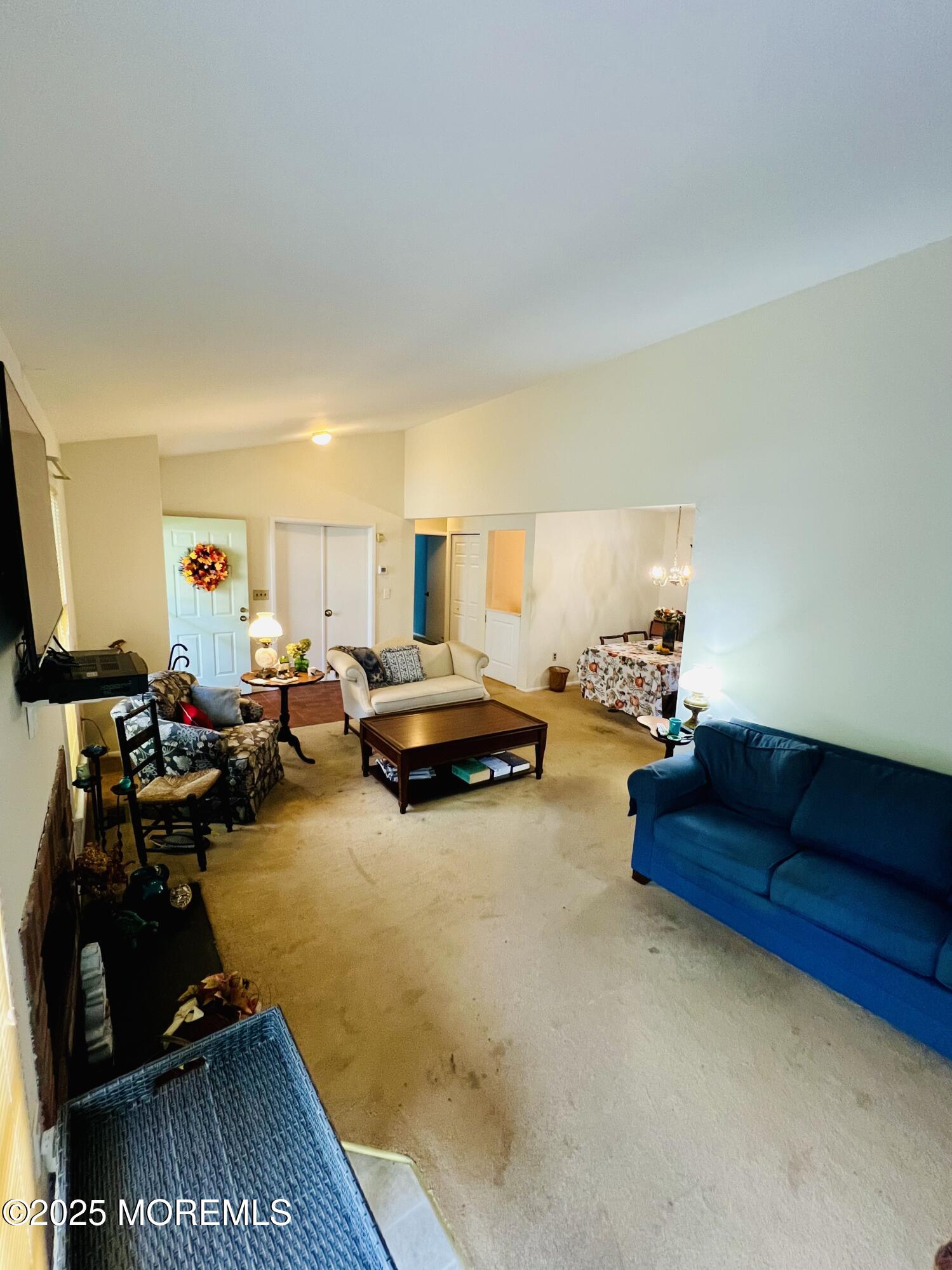 29 Mulberry Court, Unit D Brielle, NJ 08730 - Photo 8 of 22 a living room with furniture hard wood floor and a flat screen tv