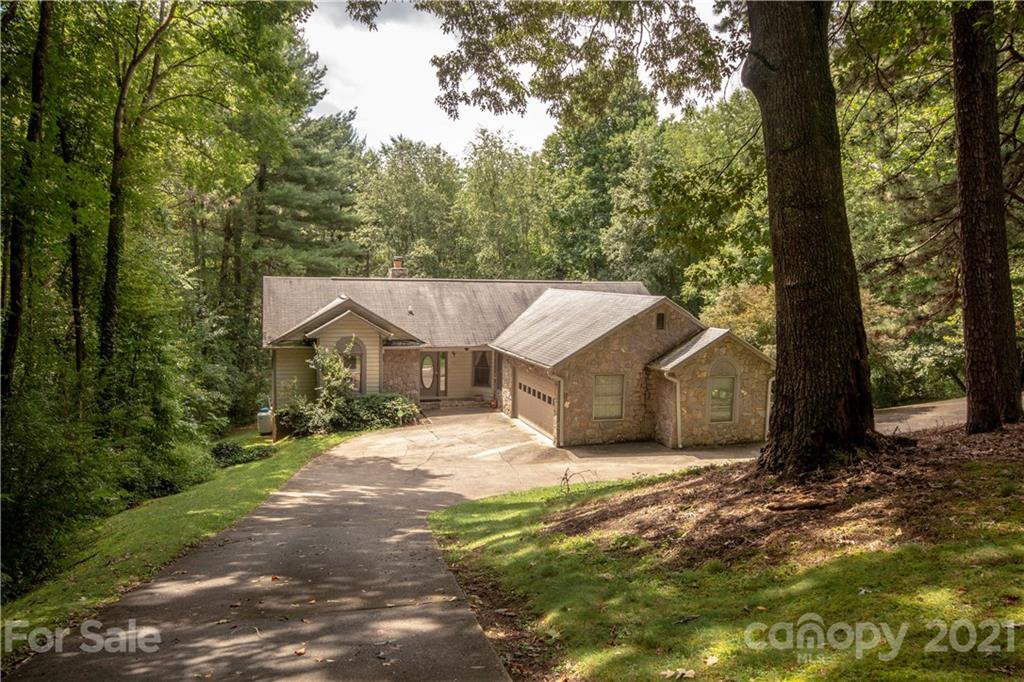 449 Oak Ridge Drive Clyde, NC 28721 - Photo 1 of 18 a view of a house with a small yard
