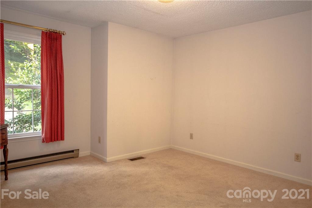 449 Oak Ridge Drive Clyde, NC 28721 - Photo 14 of 18 a view of an empty room and window