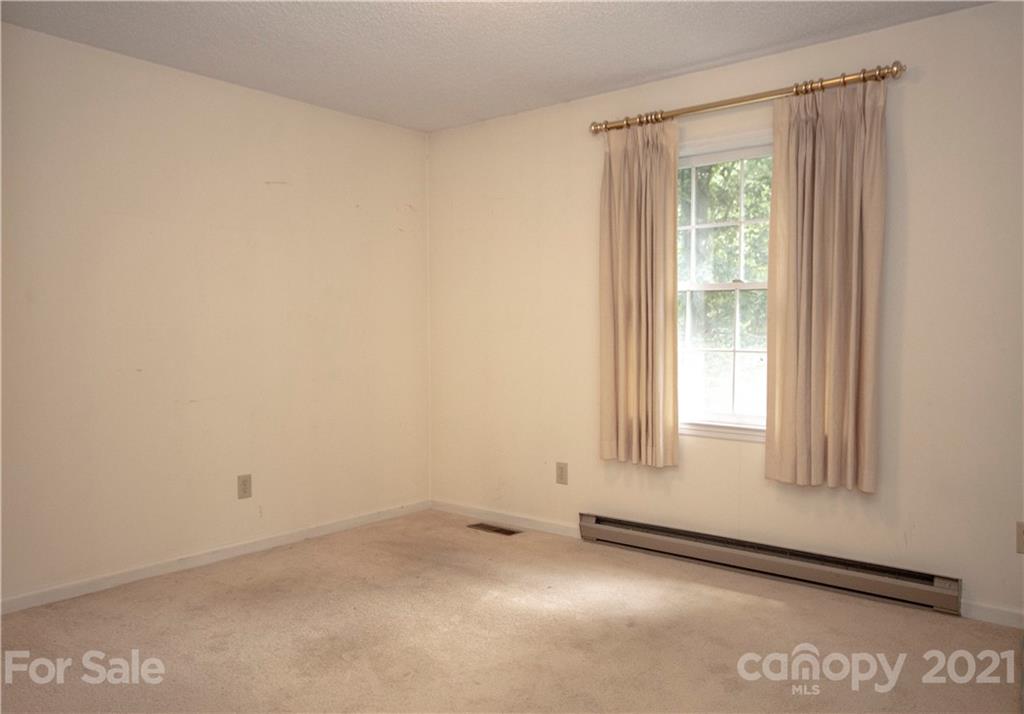 449 Oak Ridge Drive Clyde, NC 28721 - Photo 16 of 18 an empty room with a window