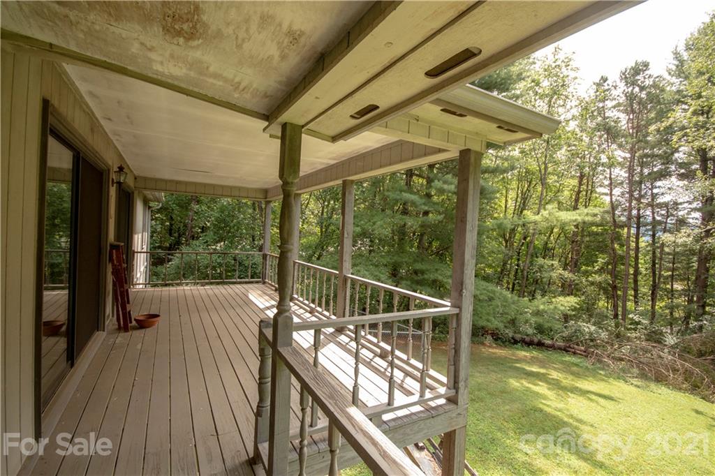 449 Oak Ridge Drive Clyde, NC 28721 - Photo 17 of 18 a view of a balcony with wooden floor