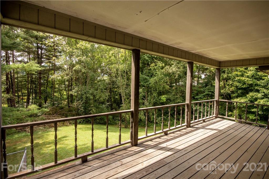 449 Oak Ridge Drive Clyde, NC 28721 - Photo 18 of 18 a view of balcony with wooden floor