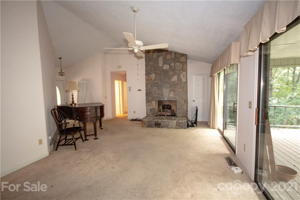 449 Oak Ridge Drive Clyde, NC 28721 - Photo 7 of 18 a view of a livingroom with furniture and a window