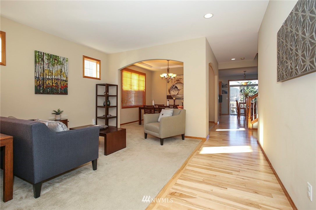 813 Field Avenue Northeast Renton, WA 98059 - Photo 2 of 22 a living room with furniture and a gate