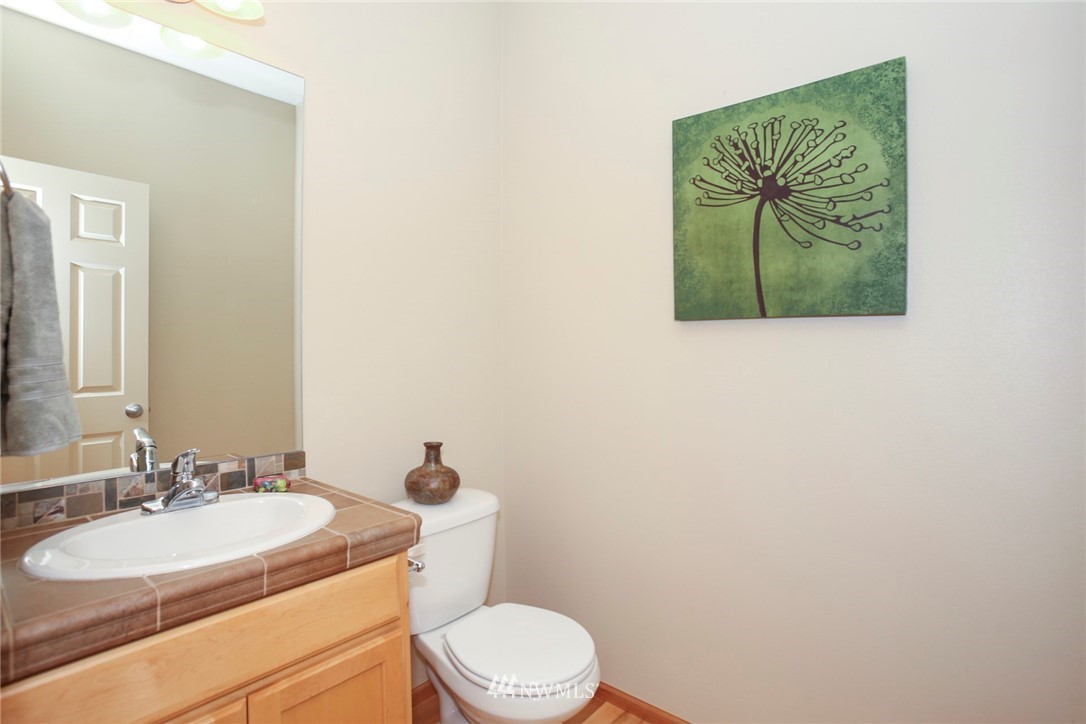 813 Field Avenue Northeast Renton, WA 98059 - Photo 12 of 22 a bathroom with a toilet sink and mirror