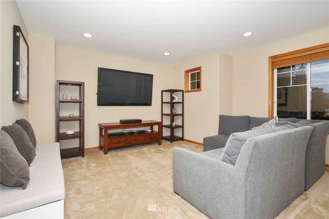 813 Field Avenue Northeast Renton, WA 98059 - Photo 13 of 22 a living room with furniture and a flat screen tv