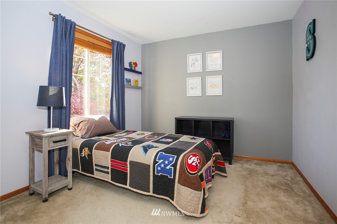 813 Field Avenue Northeast Renton, WA 98059 - Photo 14 of 22 a bedroom with a bed and a window