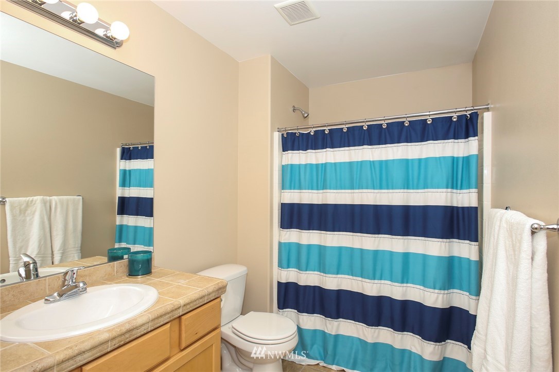 813 Field Avenue Northeast Renton, WA 98059 - Photo 15 of 22 a bathroom with a sink and a mirror