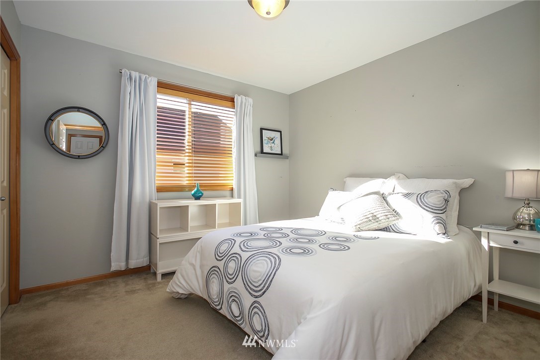 813 Field Avenue Northeast Renton, WA 98059 - Photo 16 of 22 a bedroom with a bed and a window