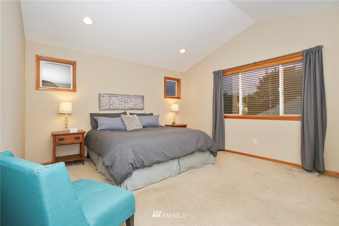 813 Field Avenue Northeast Renton, WA 98059 - Photo 17 of 22 a bedroom with a bed and a night stand