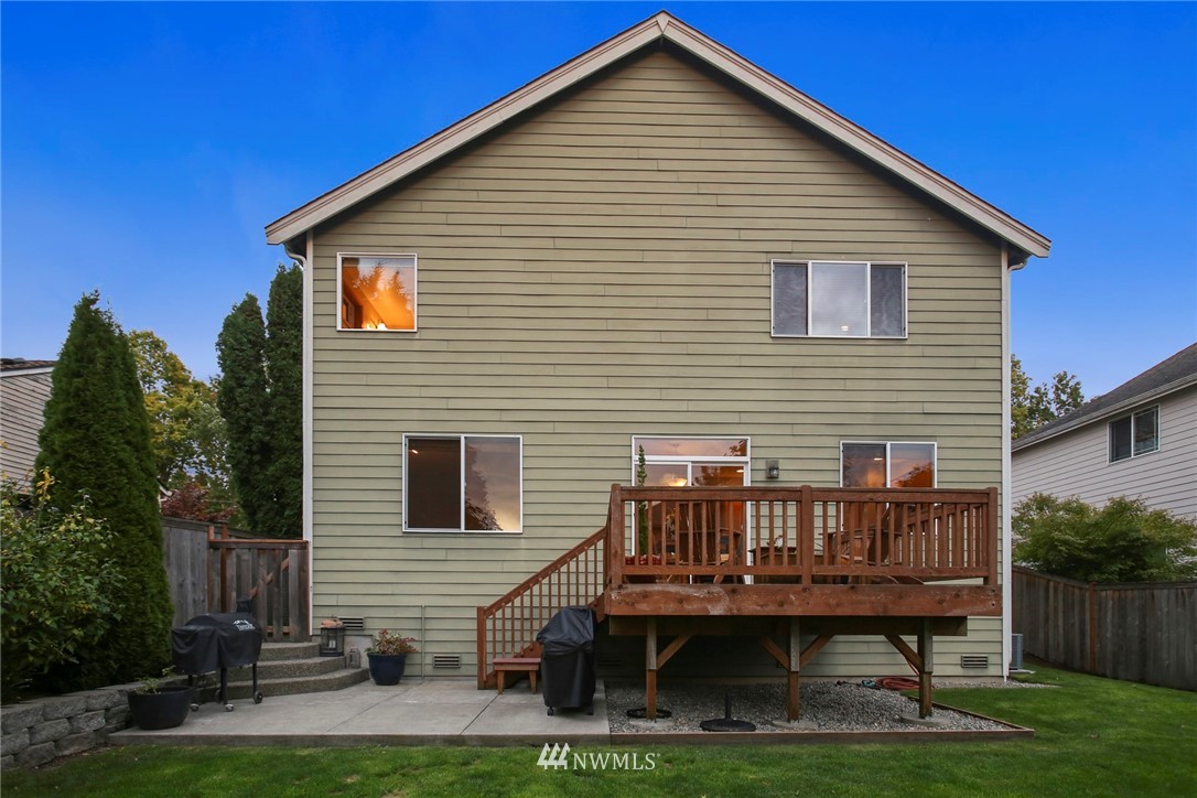 813 Field Avenue Northeast Renton, WA 98059 - Photo 21 of 22 a view of a house with a deck and a yard