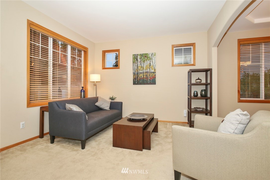 813 Field Avenue Northeast Renton, WA 98059 - Photo 5 of 22 a living room with furniture and large window
