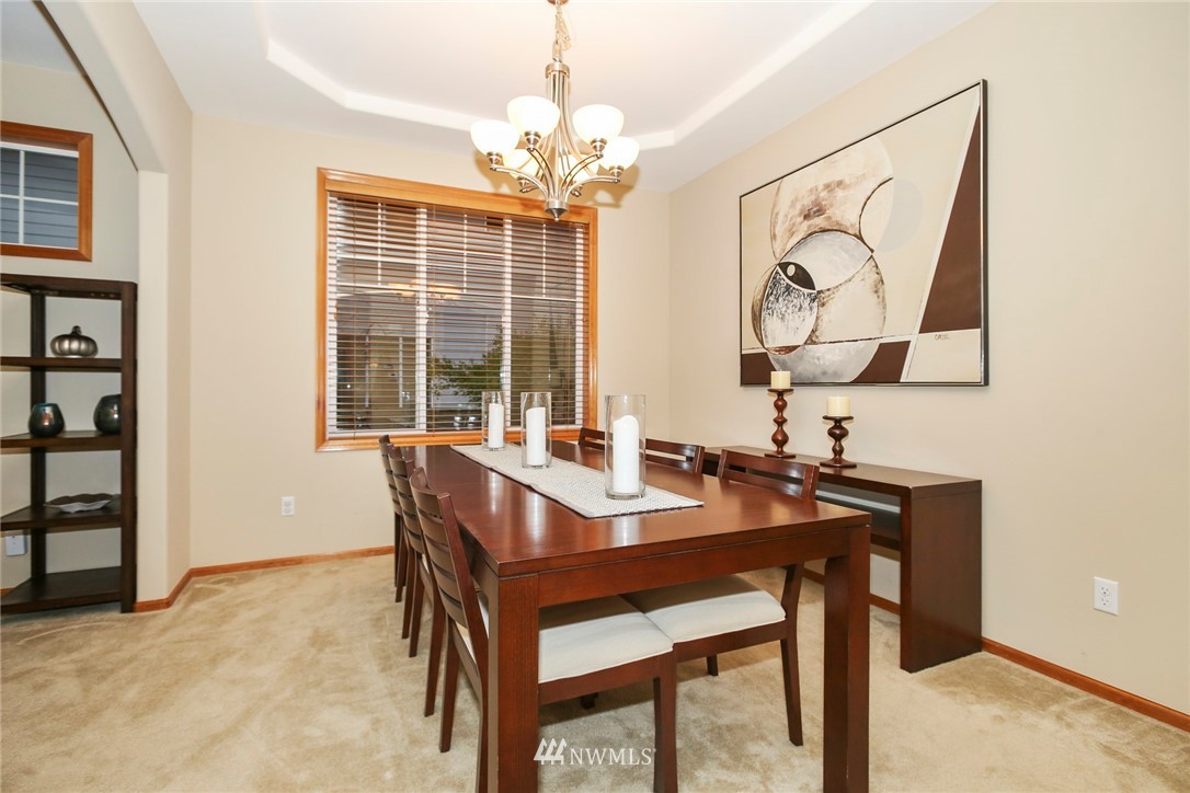 813 Field Avenue Northeast Renton, WA 98059 - Photo 6 of 22 a view of a dining room with furniture window and outside view