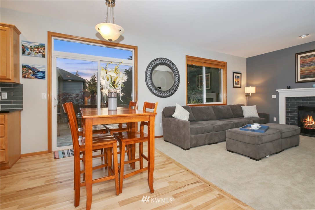 813 Field Avenue Northeast Renton, WA 98059 - Photo 7 of 22 a living room with fireplace furniture and a large window