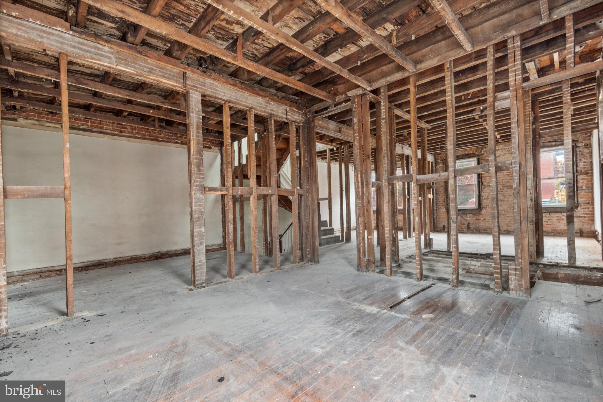 109 East 33rd Street Baltimore, MD 21218 - Photo 12 of 26 a view of an empty room with wooden frame