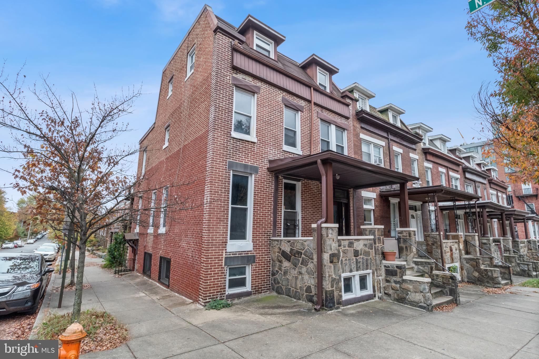 109 East 33rd Street Baltimore, MD 21218 - Photo 2 of 26 a front view of a building with outdoor seating