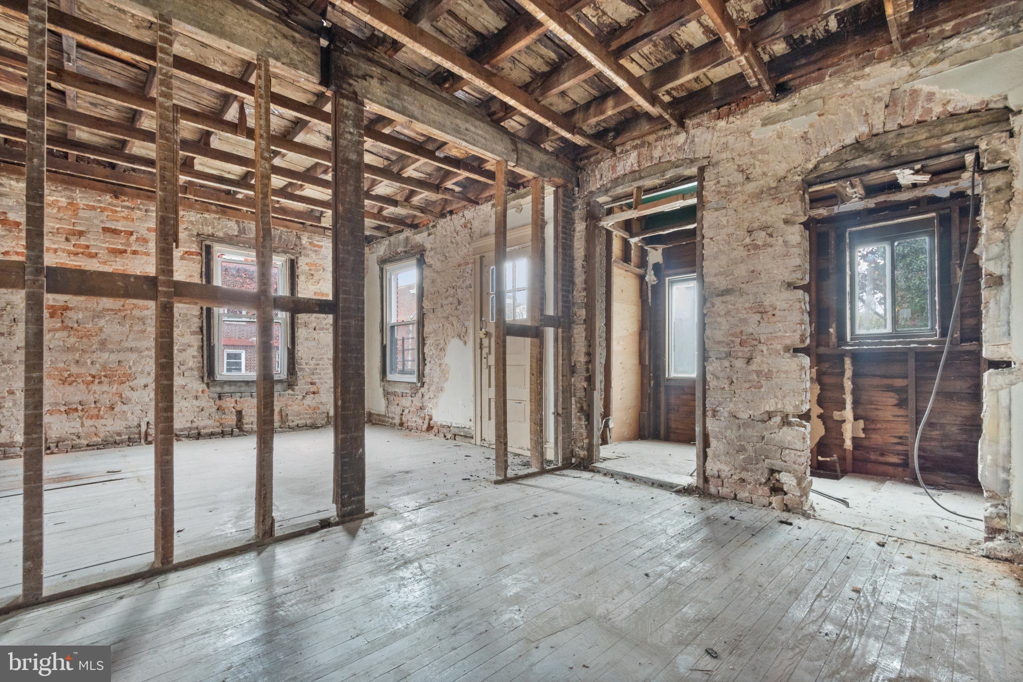 109 East 33rd Street Baltimore, MD 21218 - Photo 10 of 26 a view of a room with wooden walls