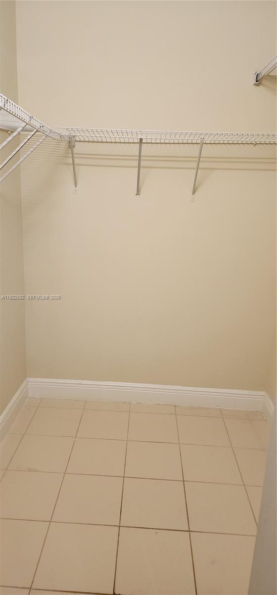 6701 Southwest 116th Court, Unit 203 Miami, FL 33173 - Photo 12 of 12 a view of an empty walk in closet