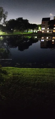a view of a lake in middle of the house