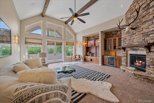 a bedroom with a large bed and a fireplace