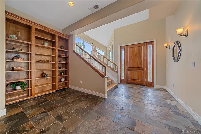 a view of an empty room with shelves