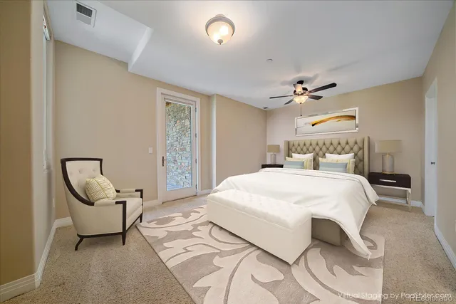 a bedroom with a bed and chair