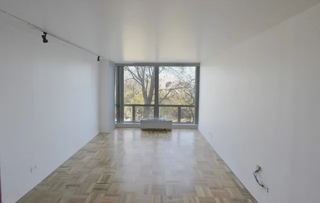 a view of a room with red carpet