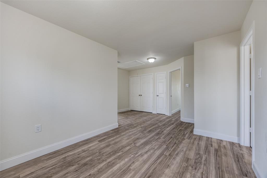 471 Meadowview Circle Van Alstyne, TX 75495 - Photo 22 of 39 a view of an empty room with wooden floor