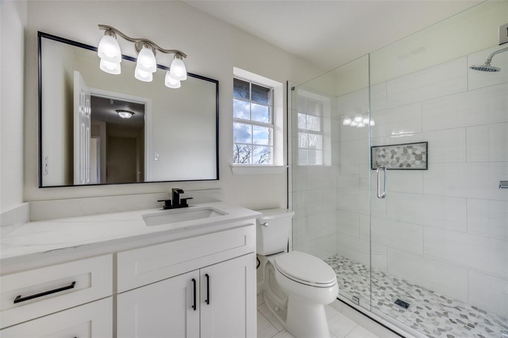 471 Meadowview Circle Van Alstyne, TX 75495 - Photo 29 of 39 a bathroom with a sink a toilet and shower